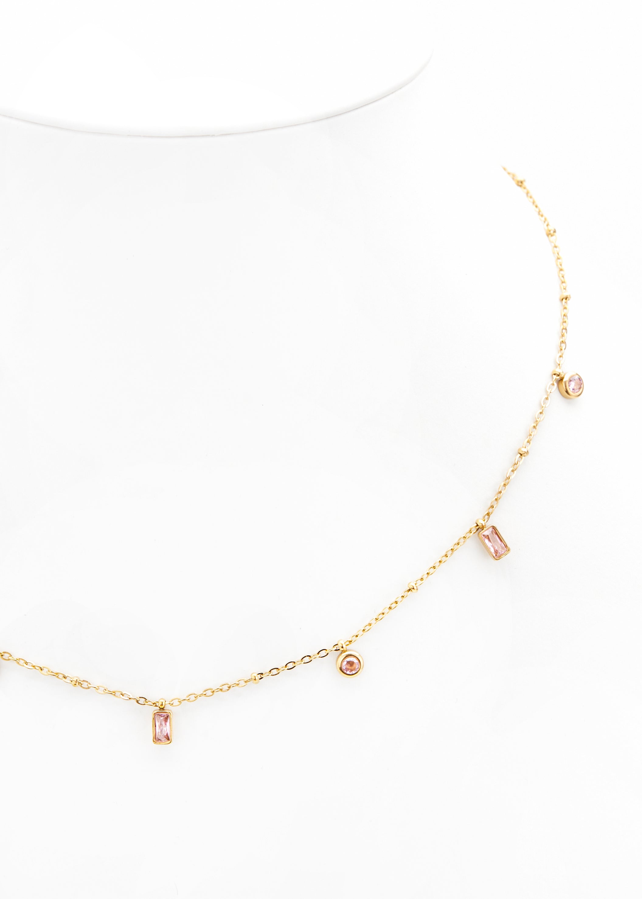 Gold chain with pink stone