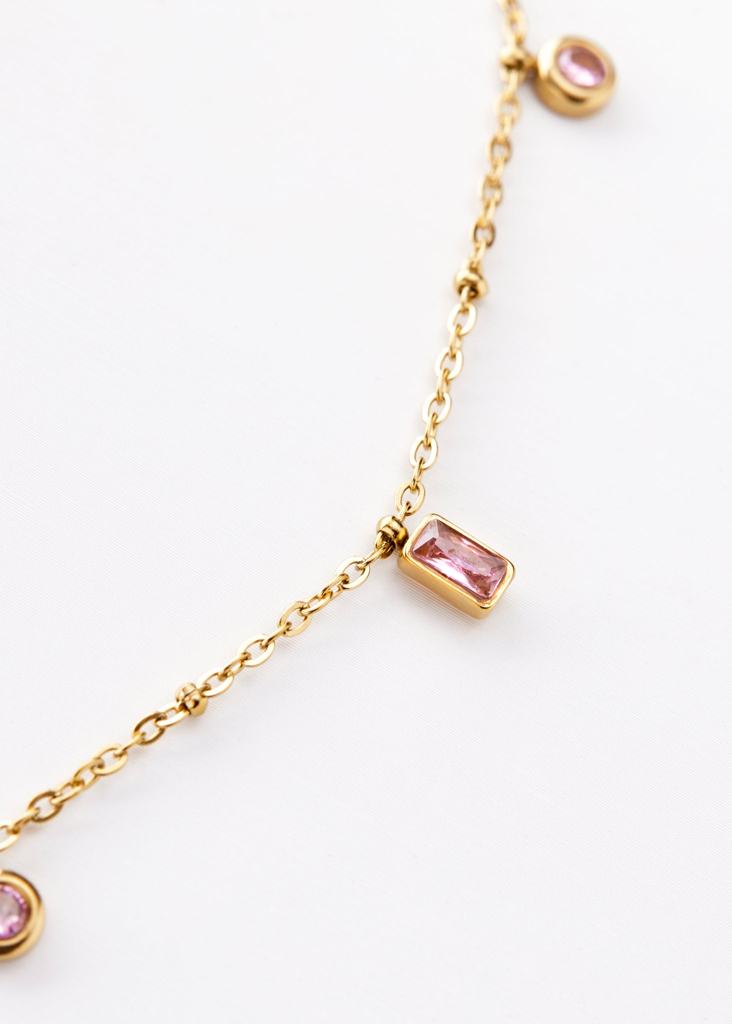 Gold chain with pink stone