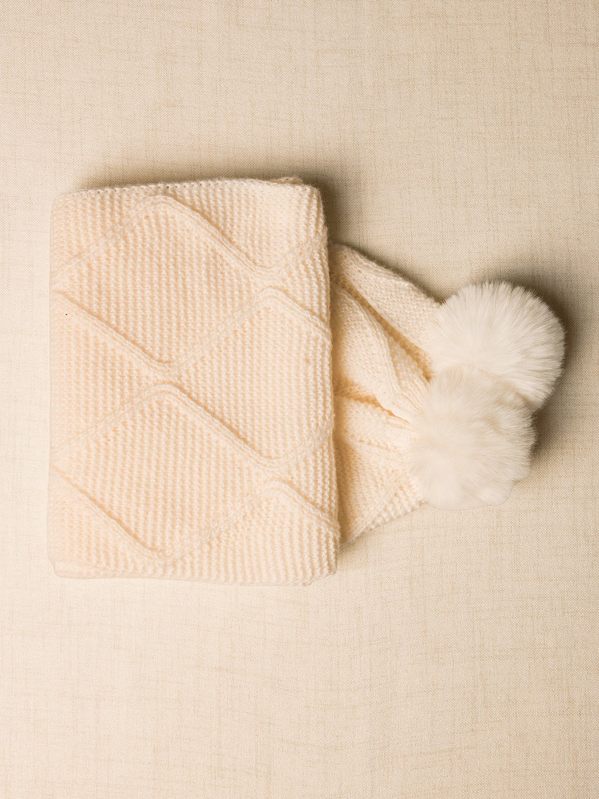 Winter scarf with pompoms